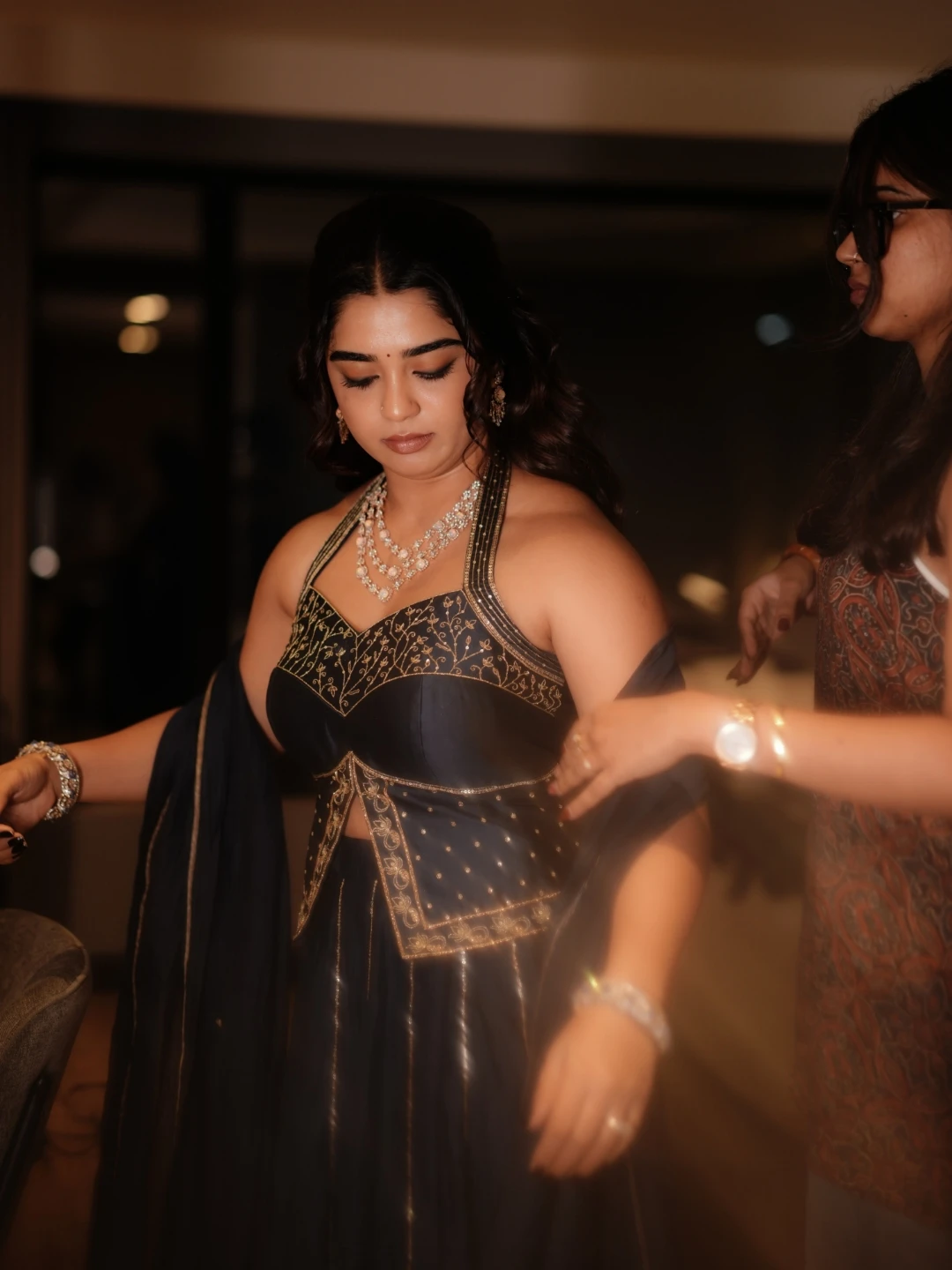 Gouri Kishan candid BTS photo getting outfit adjusted by stylist for jewellery campaign