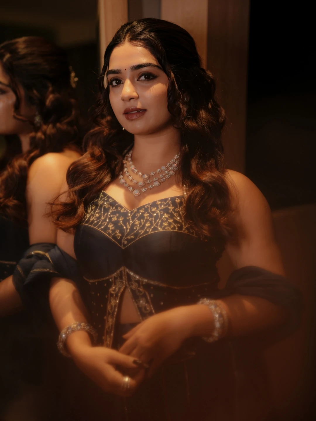 Gouri Kishan elegant close-up portrait wearing multi-strand beaded necklace
