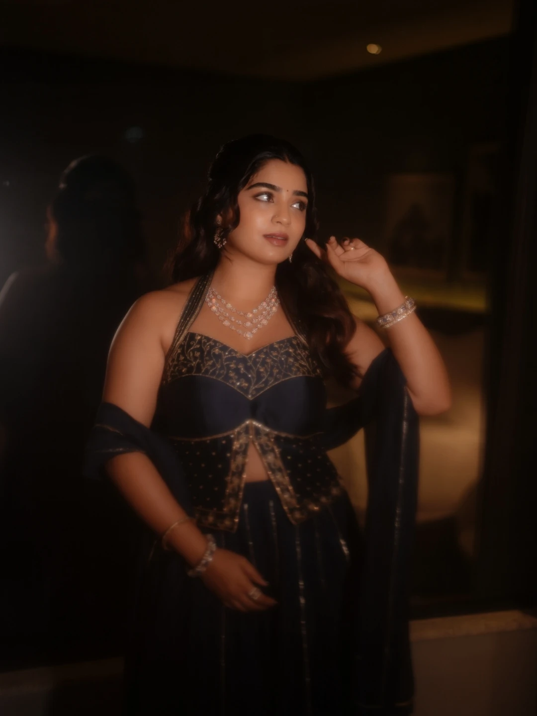 Gouri Kishan low-angle stylish pose wearing diamond jewellery and navy lehenga