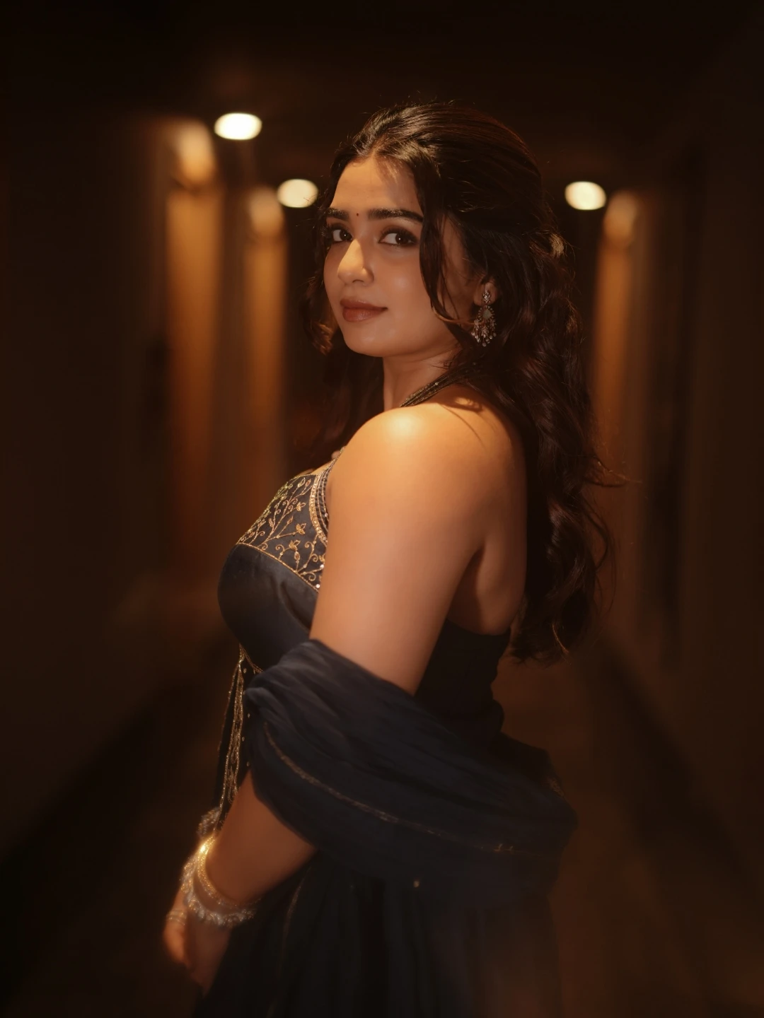 Gouri Kishan graceful over-the-shoulder look showing outfit and earrings